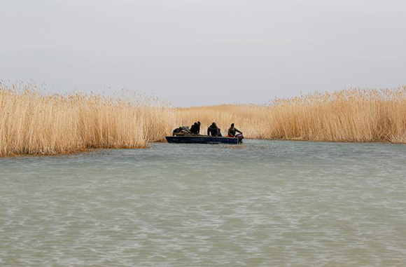  Fishermen sail a boat on the Aral Sea outside the village of Karateren, south-western Kazakhstan, April 15, 2017. Photo by Shamil Zhumatov 