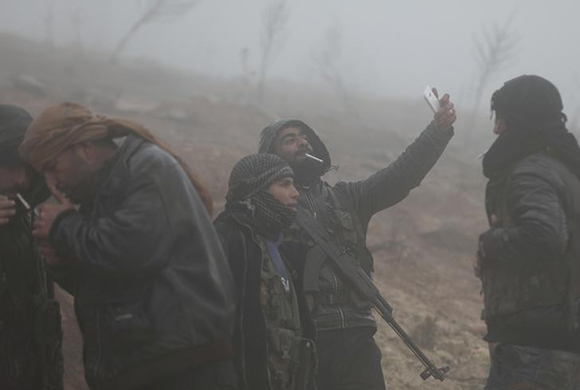  Turkish-backed Free Syrian Army fighters are seen near Mount Barsaya, northeast of Afrin, Syria January 23, 2018. Photo by Khalil Ashawi 