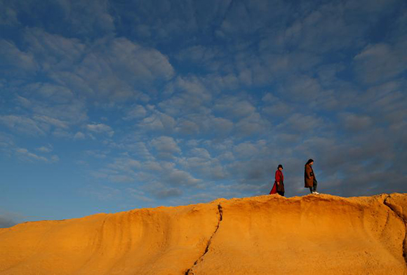  Tourists walk along the coastline at Dwejra outside the village of San Lawrenz on the island of Gozo, Malta, January 25, 2018. Photo by Darrin Zammit Lupi 