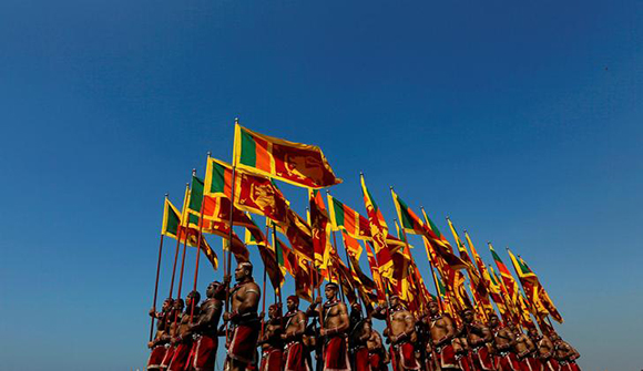  Sri Lanka's military members march with the national flags at the parade during a rehearsal for Sri Lanka's 70th Independence day celebrations in Colombo, Sri Lanka February 2, 2018. Photo by Dinuka Liyanawatte 