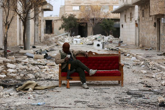  A Turkey-backed Free Syrian Army fighter is seen in the eastern suburbs of al Bab, Syria February 4, 2018. Photo by Khalil Ashawi 