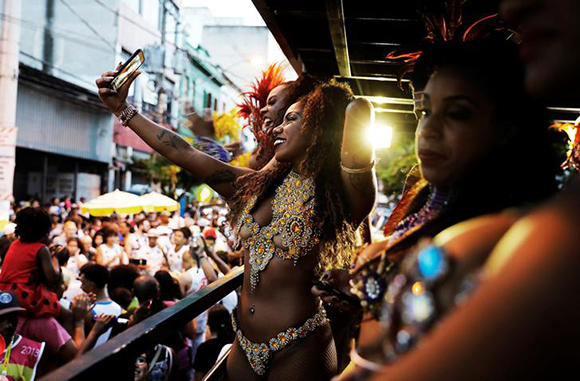  Women take part in an annual block party known as "Banda do Candinho e Mulatas" (Candinho Band and Mulatto Women), during carnival festivities at Bixiga neighbourhood in Sao Paulo, Brazil, February 7, 2018. Photo by Nacho Doce 