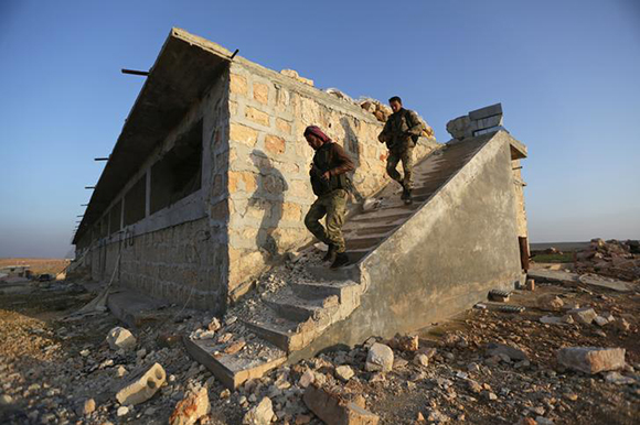  Turkey-backed Free Syrian Army fighters are seen in the eastern suburbs of al-Bab, Syria February 8, 2018. Photo by Khalil Ashawi 