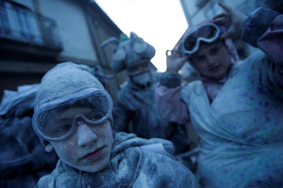  Revellers participate in a flour fight during the "O Entroido" festival in Laza village, Spain February 12, 2018. Photo by Miguel Vidal 