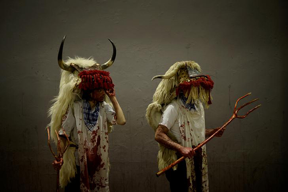 People dressed as Momotxorros, half bull, half man figures dressed in blood soaked sheepskins, take part in carnival celebrations in Alsasua, Spain, February 13, 2018. REUTERS/Vincent West TPX IMAGES OF THE DAY