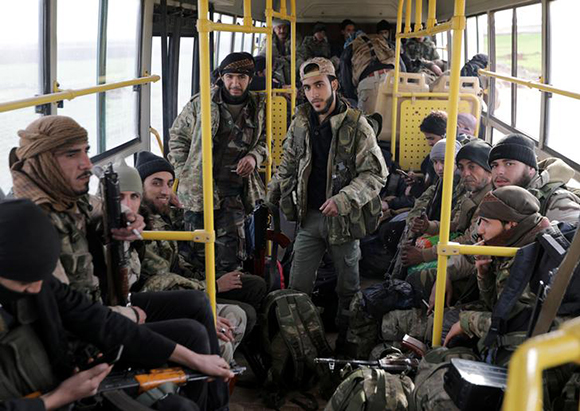  Turkish-backed Free Syrian Army fighters are on a bus in the town of al-Rai, Syria February 14, 2018. Photo by Khalil Ashawi 