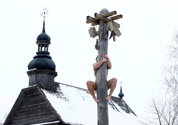  A man climbs up a wooden pole to get a prize during celebration of Maslenitsa, or Pancake Week, in Belarusian state museum of folk architecture and rural lifestyle near the village Aziarco, Belarus, February 17, 2018. Photo by Vasily Fedosenko 