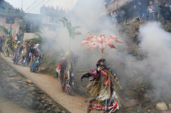  Villagers dressed up as local mountain gods walk around to give good wishes during a celebration event for Chinese Lunar New Year in a Miao village in Liuzhou, Guangxi Zhuang Autonomous Region, China. Photo by Stringer 