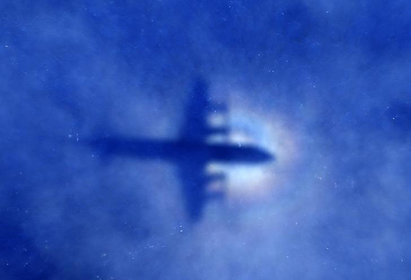  The shadow of a Royal New Zealand Air Force (RNZAF) P3 Orion maritime search aircraft can be seen on low-level clouds as it flies over the southern Indian Ocean looking for missing Malaysian Airlines flight MH370 Photo by Rob Griffith 