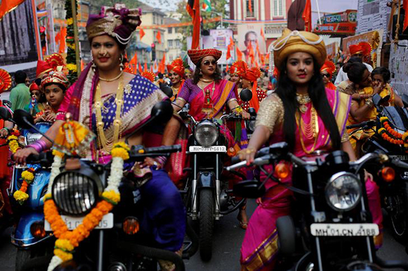  Women dressed in traditional costumes ride motorbikes as they attend celebrations to mark the Gudi Padwa festival, the beginning of the New Year for Maharashtrians, in Mumbai, India March 18, 2018. Photo by Danish Siddiqui 
