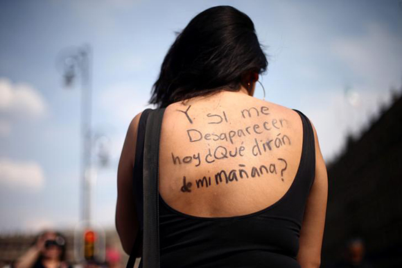  A woman takes part in a demonstration demanding justice for the female victims of violence in Mexico, in Mexico City, Mexico February 25, 2018. The words read: "And if I disappear today, what would they say about me tomorrow?". Photo by Edgard Garrido 