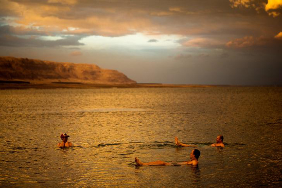  Tourists from Poland float in the Dead Sea during sunset, near Metzoke Dragot in the Israeli occupied West Bank Photo by Ronen Zvulun 