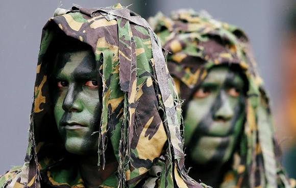  Sri Lanka's Special Task Force (STF) members look on at a rescue demonstration during the 35th anniversary in Kalutara, Sri Lanka Photo by Dinuka Liyanawatte 