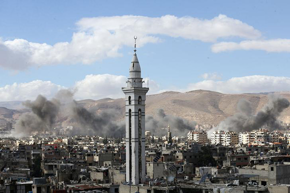  Smoke rises from the besieged Eastern Ghouta in Damascus, Syria, February 27, 2018. Photo by Bassam Khabieh 