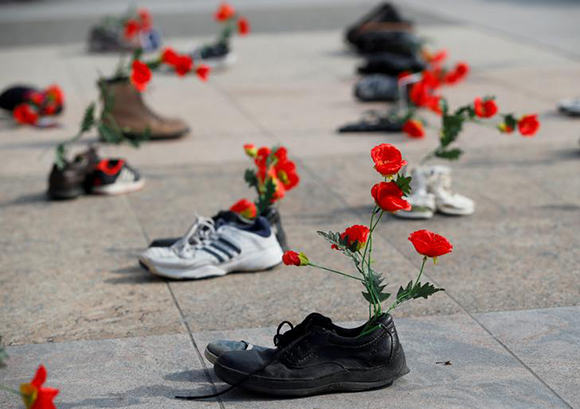  Shoes with flowers are pictured during a demonstration against the speech of Seyyed Ali Reza Avai, Minister of Justice of Iran, at the Human Rights Council, in front of the United Nations in Geneva, Switzerland, February 27, 2018. Photo by Denis Balibouse 